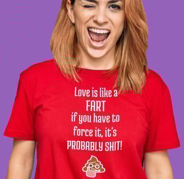 Smiling woman wearing a funny red graphic trendy t-shirt with a humorous quote about love and farts.