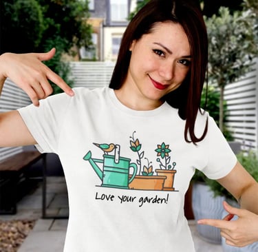 Smiling woman wearing a white gardening trendy t-shirt with a watering can and flower illustration.