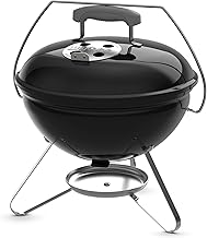 Portable black charcoal kettle grill with lid lock and ash catcher for outdoor camping.