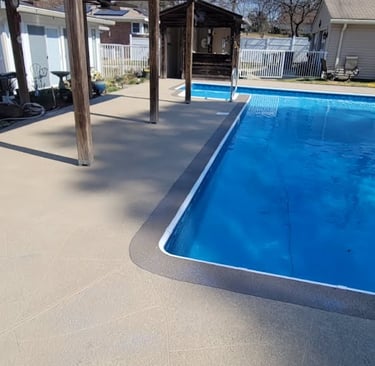 a pool with a patio and a patio area