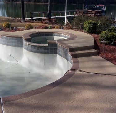 a pool with a large pool and a dock