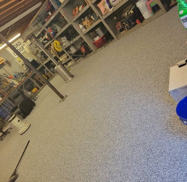 a room with a blue and white flooring and a blue floor