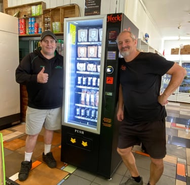 Commercial snack and drink vending machine installed at an Australian retail location.