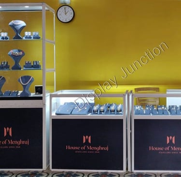 a display case with a clock and jewelryExhibition by Bhima Jewellers Kerla using our Portable Showca