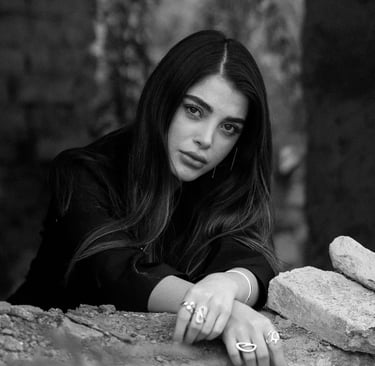 a beautiful woman looking and staring; asking herself "does he miss me?"