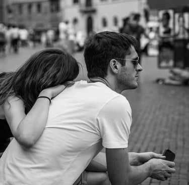 A man ignoring his girlfriend and her affection