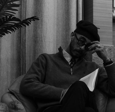 a stressed out man who is quietly reading his book to escape the realities of life