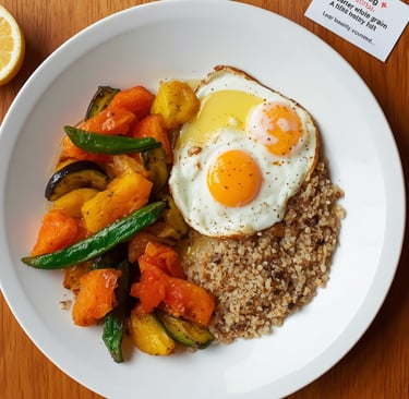 Healthy breakfast bowl with fried eggs, quinoa, and roasted vegetables on a wooden table.