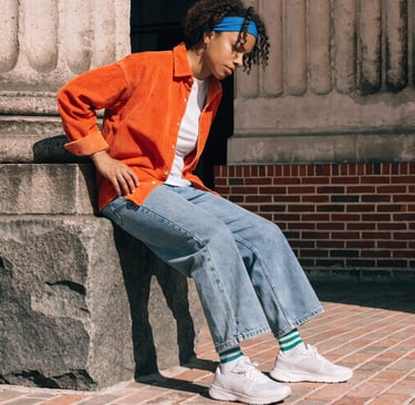 Adult indicating hip and leg area commonly affected by sciatica symptoms