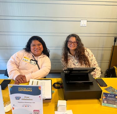 Volunteers helping check in guest at Spiritual WTF?! Experience.