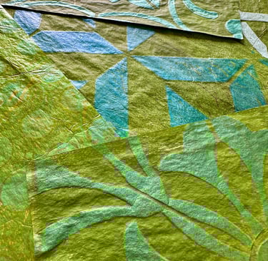 Green collage papers with bold stencil leaf pattern