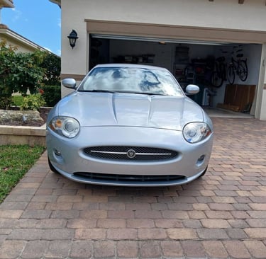 A front view of a silver 2007 Jaguar XK (X150). coupe.