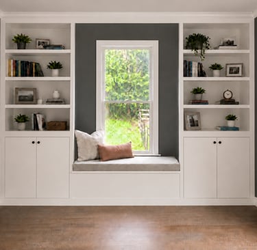 Custom built-in bookcases with window seat and storage cabinets in a Monmouth County NJ home