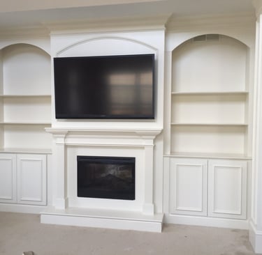 Custom fireplace wall with television and built-in cabinetry in NJ