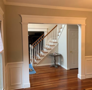 Custom crown molding, doorway casing, and wainscoting in a Monmouth County NJ home