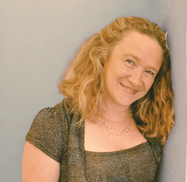 Photo of Maree Gifkins leaning against a wall