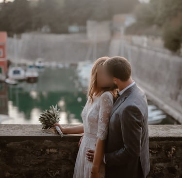 The photo shows a couple in love on their wedding day, overlooking the small city centre Port Fosa.