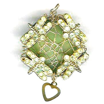 raw aquamarine pendant wrapped with gold-filled wire and dragonfly charms.
