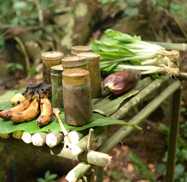 a table with bananas and other fruits and vegetables
