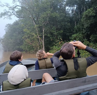 a group of people in a boat on a river
