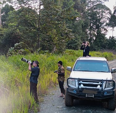 a man taking a picture of a truck with a camera