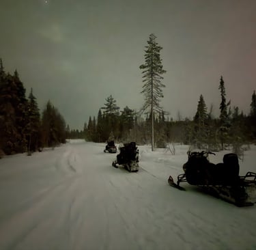 Snow mobiles out on a snow mobility ride in Ruka Finland 