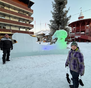 family in ruka finland by ice sign