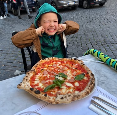 Child in Italy Rome eating pizza