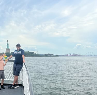 statue of liberty ferry wth kids