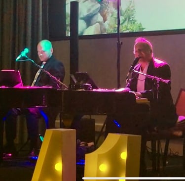 Karey Nickel plays with a fellow performer for a corporate event