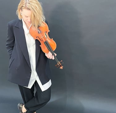 Contemporary portrait of violinist Zydre holding a violin, interdisciplinary classical music artist