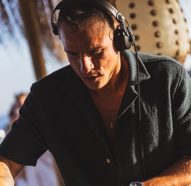 Miguel Cuartín, Artistic Director of SOLÉ, performing a deep house set during the sunset
