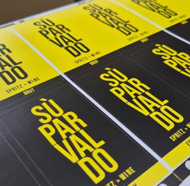 Custom printed Su Par Valdo spritz wine labels in yellow and black on a sheet.