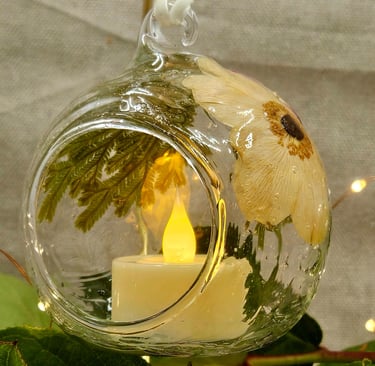 a candle with a candle in a glass vase