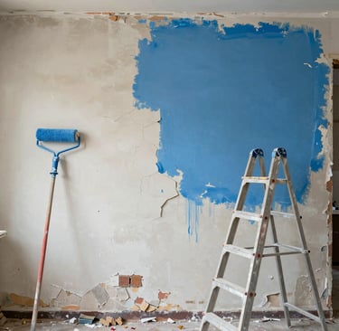 Close-up of professional painter’s hand applying smooth, even coat of paint on a wall.