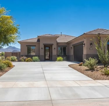 newly finished residential concrete driveway in a suburban Arizona neighborhood