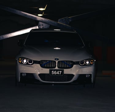 night shot of a white bmw active 3 3 series