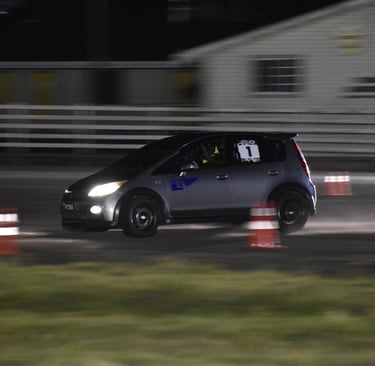 photo showing tarmac takeover winning 2wd car. charlie thomas mitsubishi colt