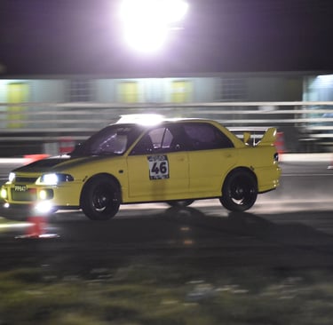 photo showing tarmac takeover winning awd car. keith francis mitsubishi evo 3