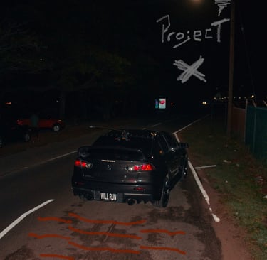 black evo 10 lining up for a drag race