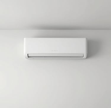 An outdoor air source heat pump unit installed on a white wall of a modern residential home.