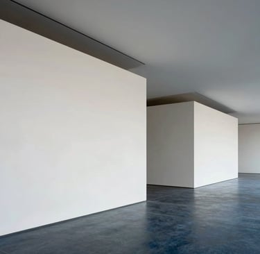 A refined architectural photograph of a modern art gallery interior, featuring minimalist clean lines in crisp off-white and muted ocean grey, with soft light casting deep slate blue shadows across the floor.