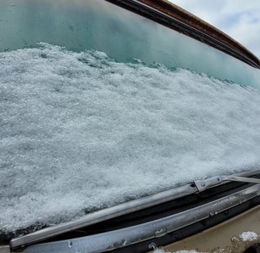 snow on the windshield of an old truck