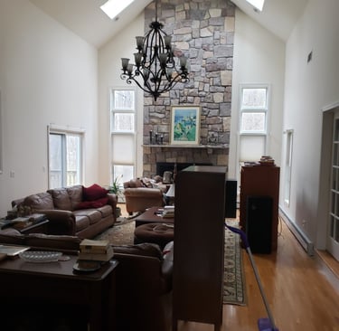 a living room with a chandelier and a chandelier
