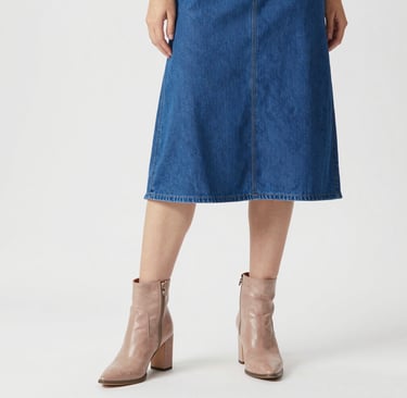 woman in blue dress standing