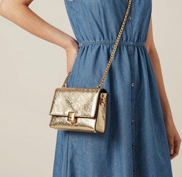 woman in blue dress standing