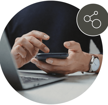 Man holding a phone with icon showing connected