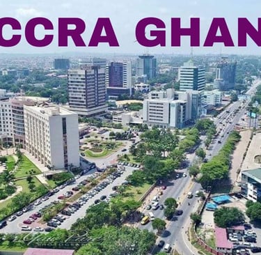 Aerial view of Accra Ghana city skyline with modern buildings, hotels, and busy streets.