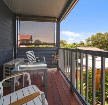 Private balcony at Marche Home Stay with cosy seating, garden views, and a peaceful outdoor space to relax.