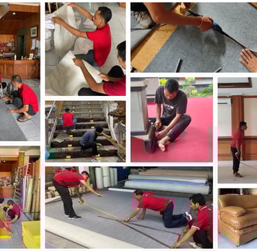 Professional carpet installers measuring, cutting, and fitting floor rugs and wall-to-wall carpeting in a building.